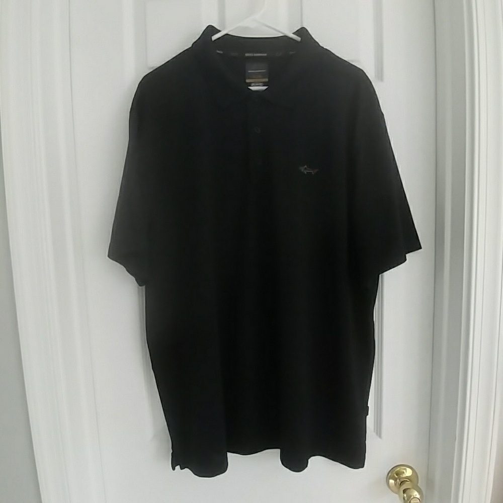 Greg Norman, black polo